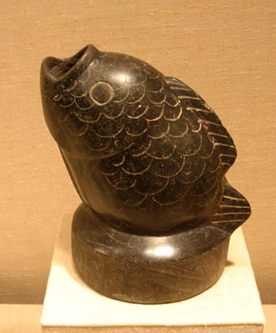 Ceramic fish-shaped vessel identified as Olmec. Painted black with traces of cinnabar. 1200 - 900 BC. 