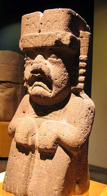 A seated Olmec were-jaguar statue.