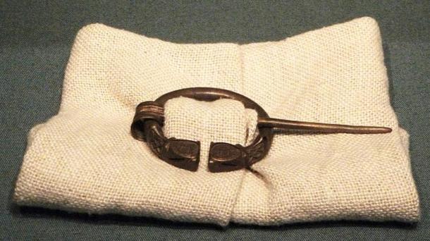 Mock-up with modern fabric, showing how these types of brooches were used. British Museum.