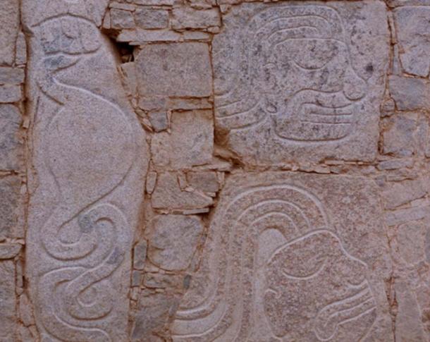 The carving on the left depicts a stomach and intestines 