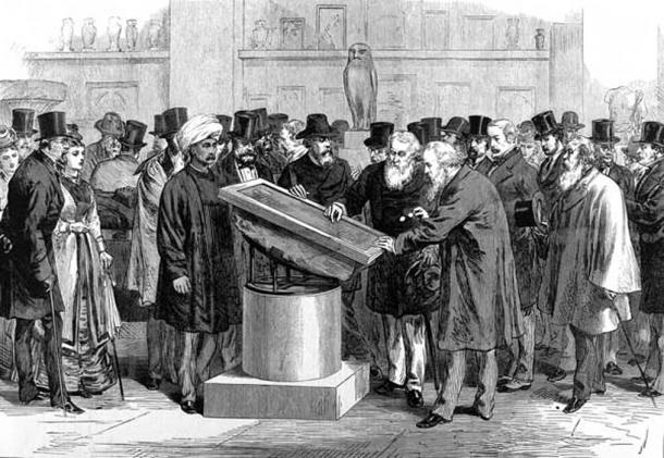 Experts inspecting the Rosetta Stone during the International Congress of Orientalists of 1874.