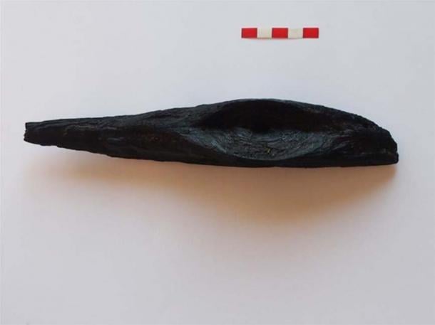 A wooden censer previously found at the site.