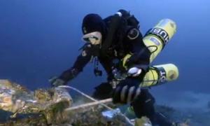 Spectacular new artifacts recovered from 2,050-year-old Antikythera Shipwreck Diver-securing-an-artifact