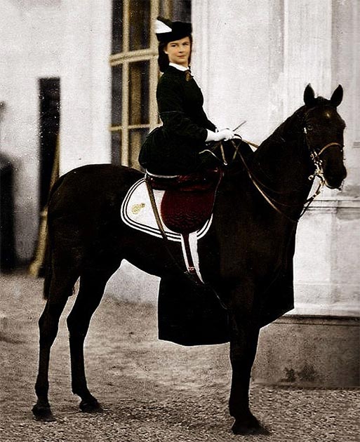 The Empress of the Hapsburg Empire, Elisabeth Amelie Eugenie of Wittelsbach, known as Sissi, posing on a horse in 1896 in Biarritz, France. (Unidentified photographer / Public domain)