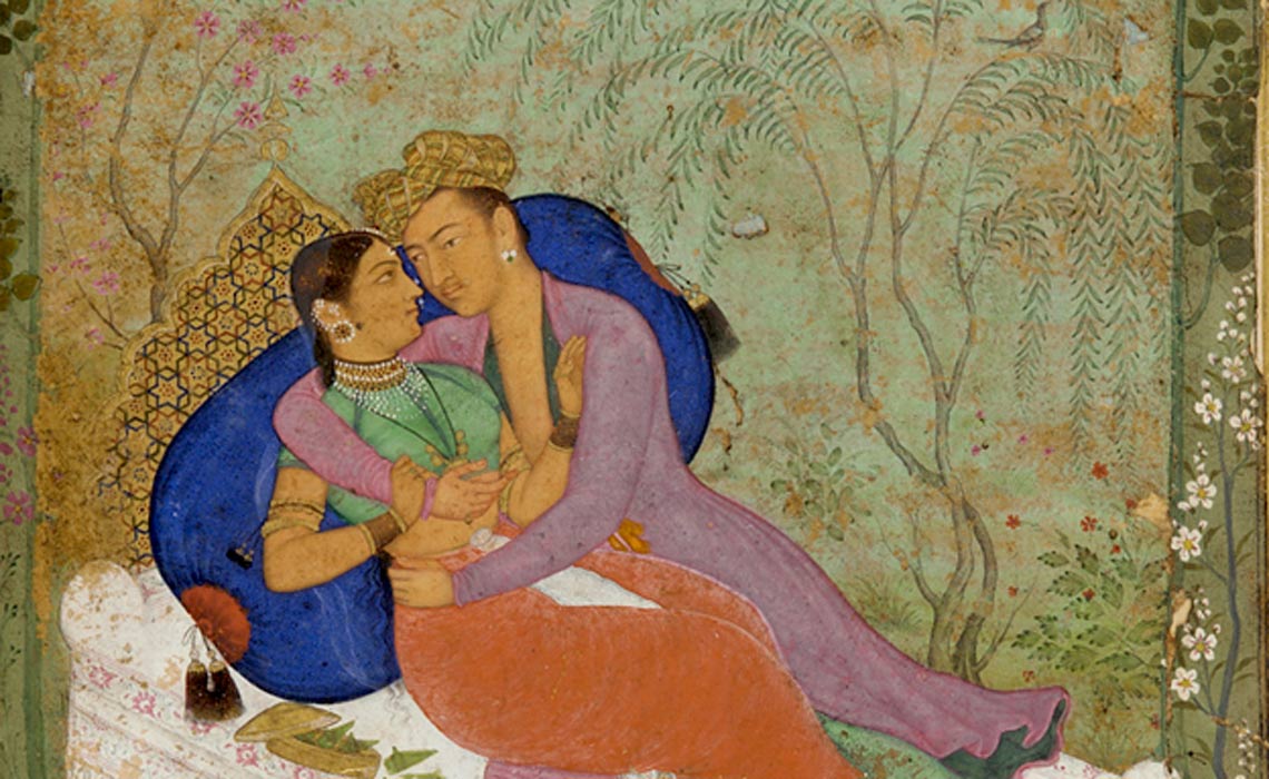 Kama Sutra couple on bed.
