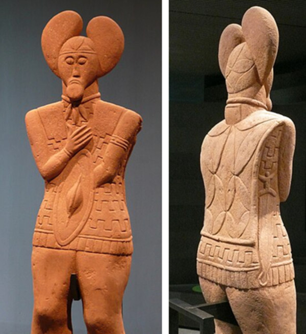 Front and back views of the statue, with sword visible from the back.