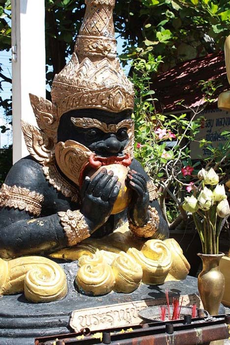 A statue depicting Kala Rau swallowing the sun, the legend being solar eclipses. Thailand.