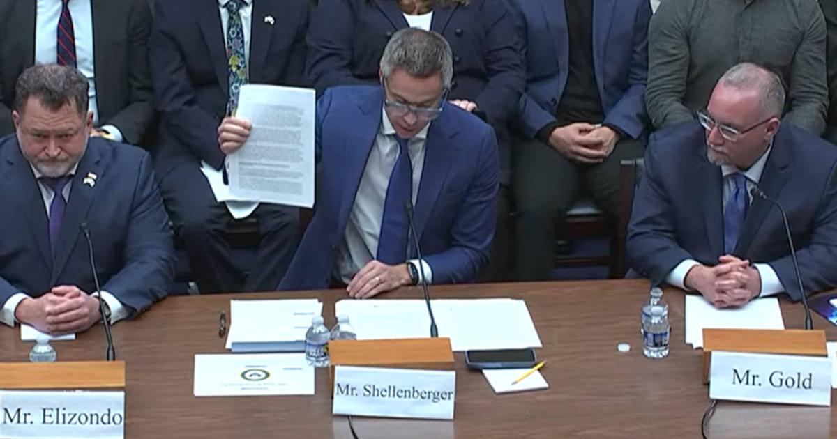 Mr Shellenberger holds up the whistleblower report at the UAP Congressional Hearing.