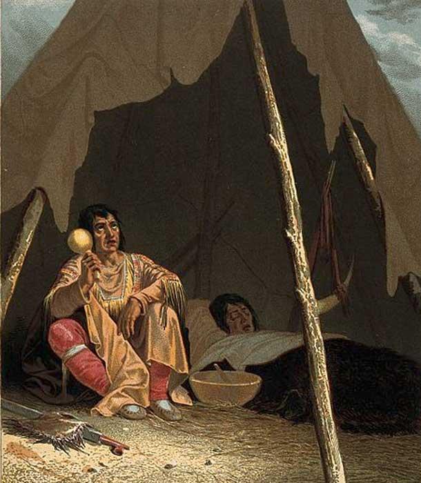 A North American Indian shaman or medicine man healing a patient.