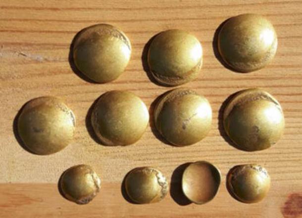 Another view of the curiously curved rainbow-cup Celtic gold coins found in the Brandenburg hoard. (Brandenburg State Office for the Preservation of Monuments and Archaeological State Museum)