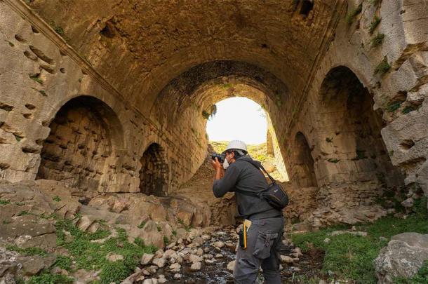 Archaeologists recording details of private seating areas at Pergamon amphitheater.  (Anadolu Agency)