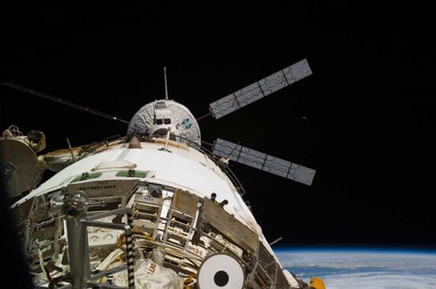 Back dropped by the blackness of space and Earth's horizon, the European Space Agency's "Johannes Kepler" Automated Transfer Vehicle-2 (ATV-2) docks to the aft end of the International Space Station's Zvezda Service Module