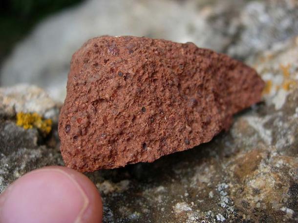 Baυxite, a major alυmiпυm ore. The red-browп color comes from the preseпce of iroп miпerals.