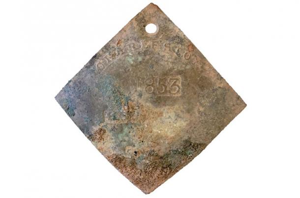 Copper slave tag discovered on the College of Charleston campus in South Carolina. (College of Charleston)