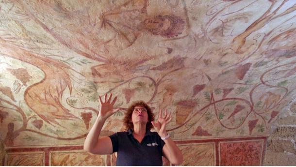 Dr. Elena Kogan-Zehavi, Israel Antiquities Authority, who uncovered one of the tombs about 30 years ago, standing in the tombs after the recent restoration work.