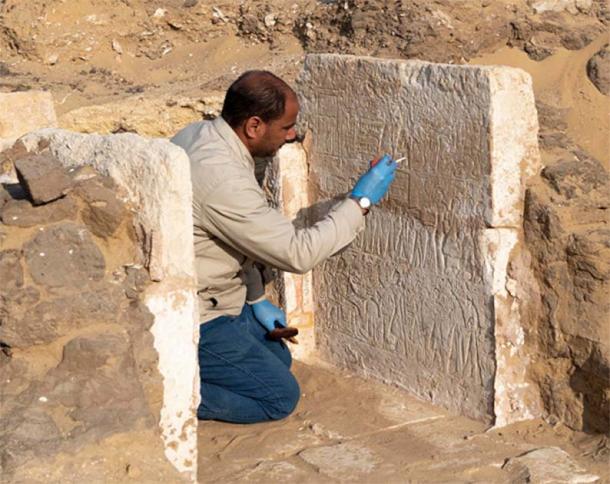 Egyptian conservator Hassan Soliman, who works for the Supreme Council of Antiquities in the Saqqara archaeological area, works to restore the fragile limestone in the small funerary chapel of Yuyu. (Ministry of Tourism and Antiquities)