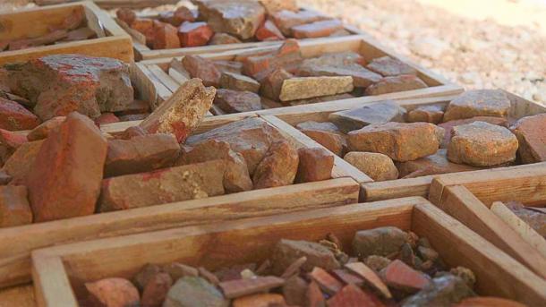 Fragments of roof tiles and paving tiles, bearing the mark of the VI Roman Legion (IAA)