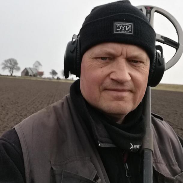 Frants Fugl Vestergaard unearthed the rare gold earring while metal detecting in a field in West Jutland. (Nationalmuseet)