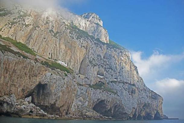 View of the Gorham Cave Complex from the sea with Gorham’s Cave in the foreground and Vanguard and Hyaena Caves behind. (© Clive Finlayson, Gibraltar Museum / UNESCO)