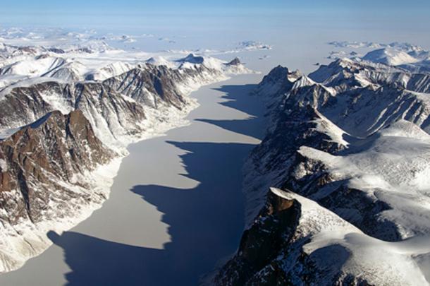 Ice-covered fiord on Baffin Island with Davis Strait in the background. Baffin Island is the largest island in the Canadian Arctic Archipelago and the fifth largest island in the world. Credit: NASA / Michael Studinger