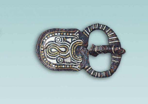 Iron belt buckle for weapon suspension with silver and brass inlay from a tomb in Collegno, Italy. (Caterina Giostra/PNAS)