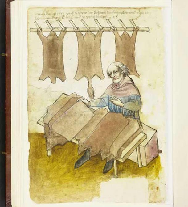 Man sorting skins after drying during leather production. (Nürnberg City Library)