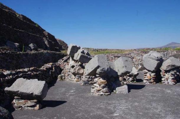 Megalithic stone blocks scattered in the vicinity of the pyramid of the Feathered Serpents at Teotihuacan. 