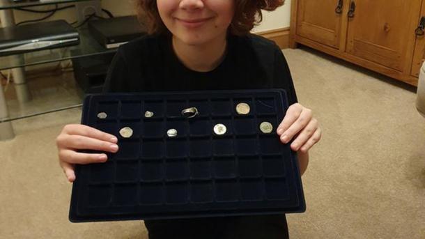 Milly Hardwick holding up some of her metal detecting hunting finds in a photo taken by her mother Claire. (Claire Hardwick / Royston Crow)