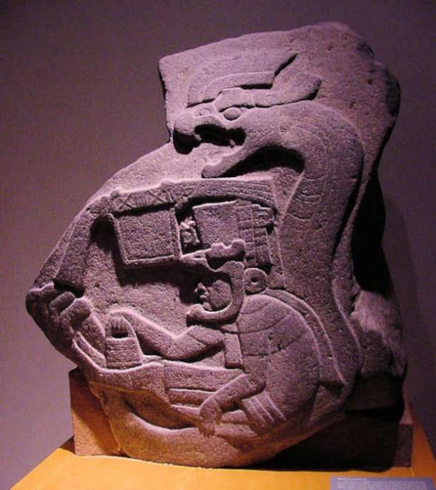 Monument 19, from La Venta, the earliest known representation of a feathered serpent in Mesoamerica, with lines that follow the stone itself. (George & Audrey Delange)