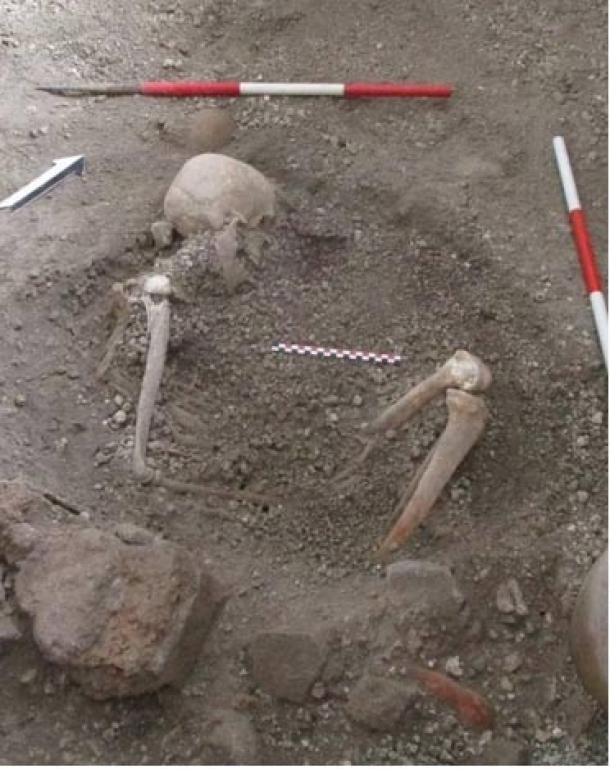 Skeleton of ‘individual 2’, a male aged around 50 years, who may have been aware of the danger and tried to protect himself with a round wooden object. The researchers found faint traces of it in the volcanic deposits. (Pompeii Archaeological Park)