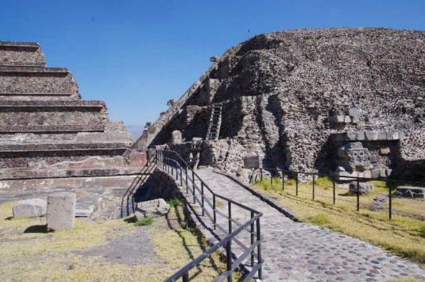 South-West corner of the pyramid of the Feathered Serpents, where the older construction phase and several megalithic stone blocks are visible under the later “adosada” platform.