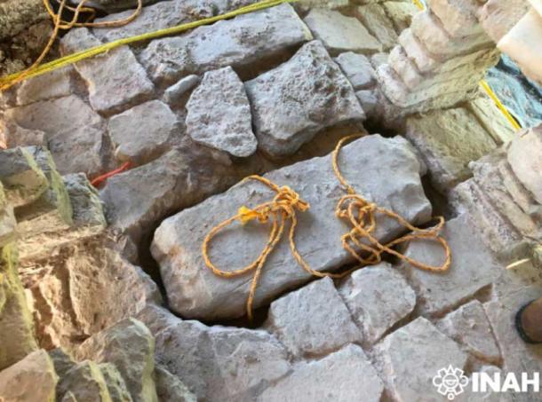 Stone covering the entrance to the rooftop access tunnel on House D Palenque Palace. (Haydeé Orea / INAH)