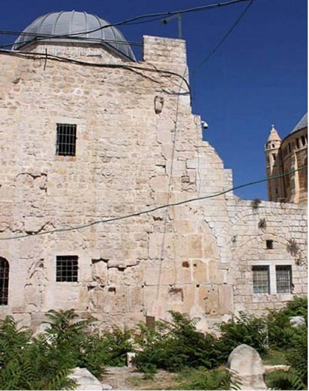 The masonry of the eastern wall of the Upper Room testifies to its “layered” history, from the Second Temple period to the Ottoman period to the Byzantine and Crusader periods. Dormition Abbey is visible on the right. (David C. Clausen/Biblical Archaeology)