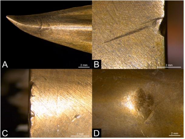 The wear and tear of bronze spearheads during the free spear fighting experiment: (A) bent tip; (B–C) socket rim damage; (D) round depression. 