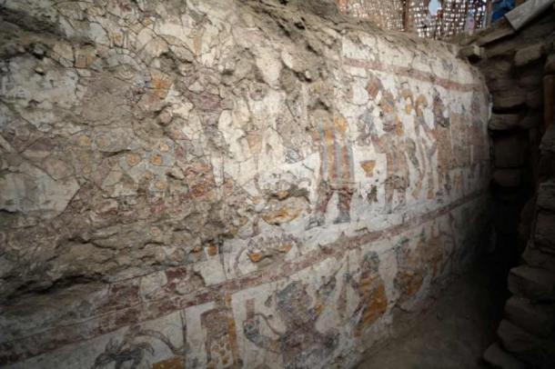 View of the crowned woman with scepter (upper left), procession of men behind her carrying objects (upper right), and textile workshop (below) painted on a wall revealed within the Hall of the Moche Imaginary in 2024. (Photograph by Lisa Trever/Pañamarca Digital and Denver Museum of Nature & Science)