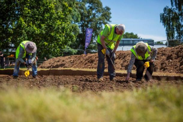 Volunteers of Time Team scour the excavated ground at Sutton Hoo site. (© National Trust)