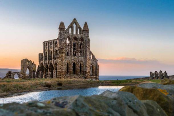 Whitby Abbey in North Yorkshire, England. A monastery was first founded on the headland in about 657 AD, and today the shell of the 13th-century Benedictine abbey is one of the largest and most impressive ecclesiastical ruins in the country.  (Jeff Baumgart / Adobe Stock)