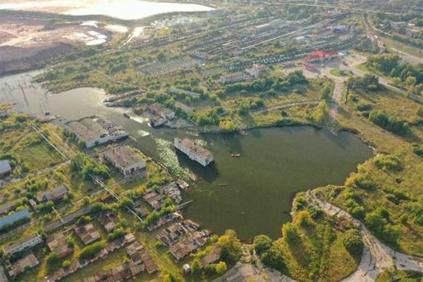 An aerial view of Berezniki, Russia, in the aftermath of a mining disaster that caused a sinkhole and flooding (andrewgiba / Adobe Stock)