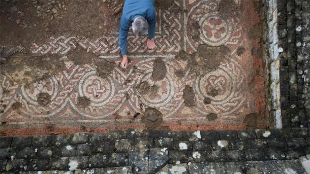 An archaeologist working on the Chedworth Roman villa mosaic that has changed the view of post-Roman history in the UK. (Stephen Haywood/© National Trust Images)