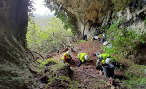 Three archaeologists excavate the location where the Roman coin hoard was unearthed, first by a badger. (Consejería de Cultura del Principado de Asturias)