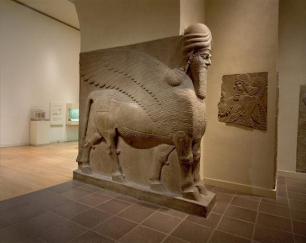 A similar human-headed winged bull (lamassu), also from Nimrud, on display at the MET. Lamassu were used to protect and support important doorways in Assyrian palaces.