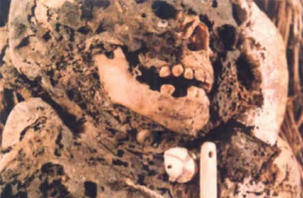 A child mummy with funerary items, from the Tres Ventanas cave in Peru