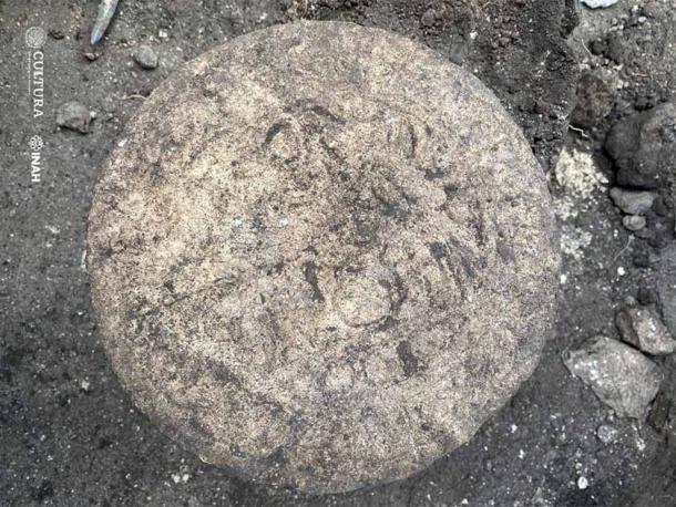 The commemorative disc when it was first excavated at Chichén Itzá. (INAH)