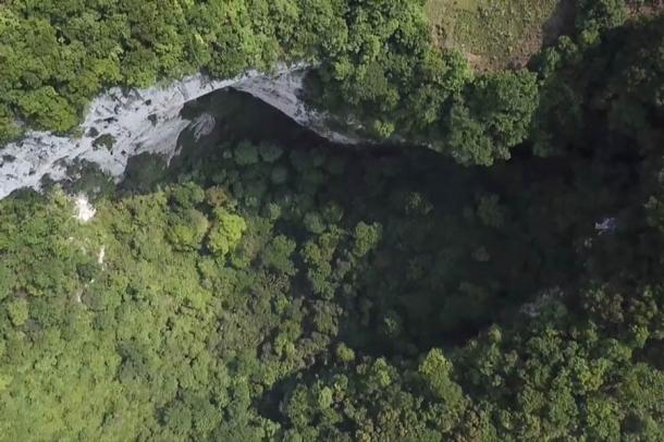 The 630-foot-deep sinkhole in China with primeval forest in its depths. (SCMP)