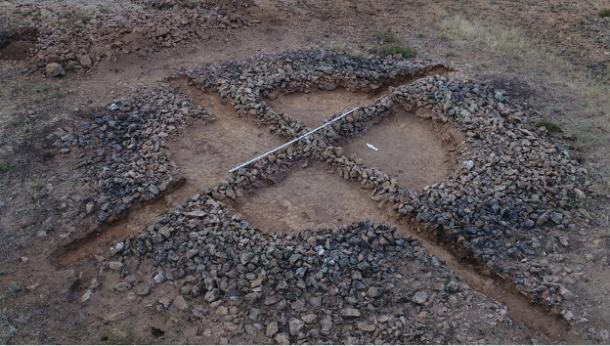 The remains of a kurgan burial mound found in Kazakhstan with two stone ridges known as 