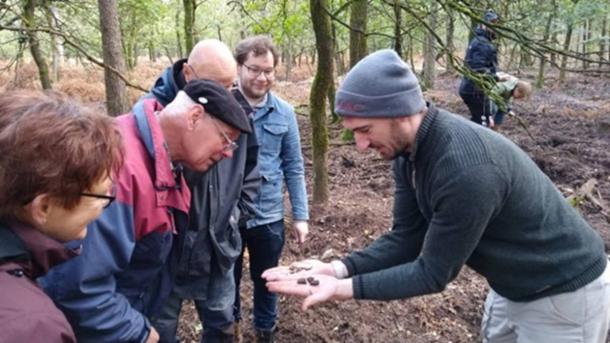 Dr Wouter Verschoof-van der Vaart with volunteers at one of the burial mounds identified during the project.