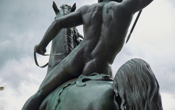 Bronze statue torso detail of a butt-naked horseman