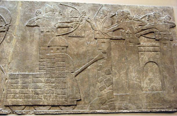 Assyrian attack on a town with archers and a wheeled battering ram, 865–860 BC. 