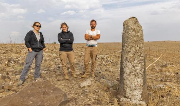 Archaeologists at a re-erected Roman milestone on the Golan Heights Roman highway.