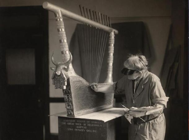 Full shot of the Bull Headed Lyre found in the Sumerian Royal Tombs of Ur, being painted at the Penn Museum. (Penn Museum)